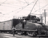 A train crew switches a refrigerated boxcar with a freight motor.