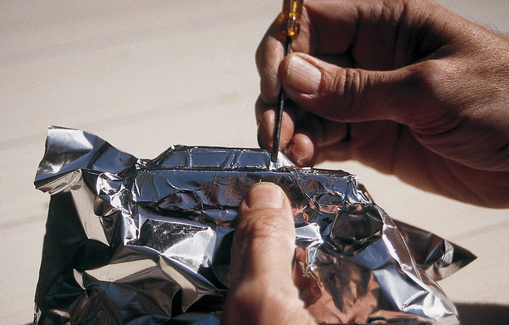  Model is wrapped with foil and details are burnished using a flat-bladed screwdriver.