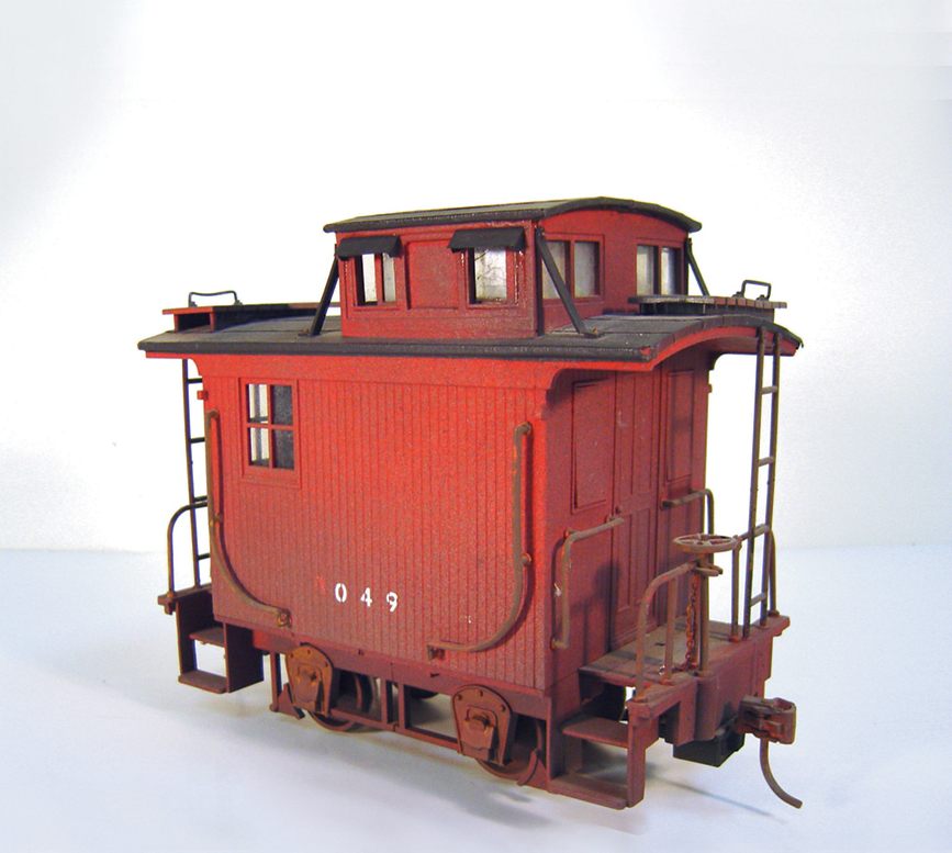 Weathering a large-scale caboose with spray paint.