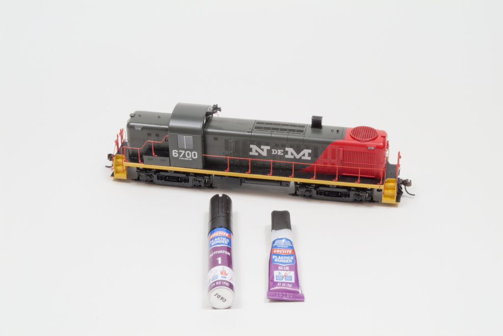 Athearn HO scale National Railways of Mexico Alco RS-3 diesel locomotive with Loctite plastics bonding system activator and glue