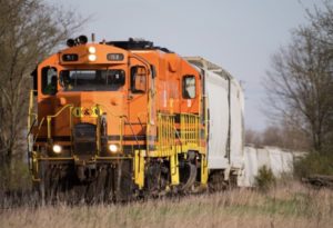 Orange diesel locomotives on freight train