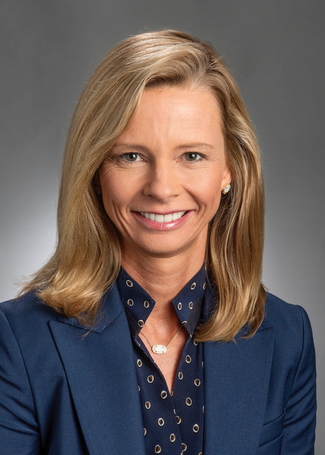 Woman with blonde hair in blue blouse