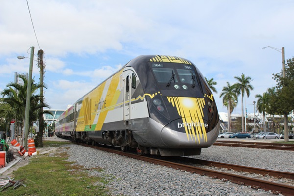 Front of a black, white, and yello train