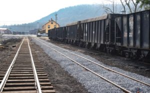 An empty track next to train cars