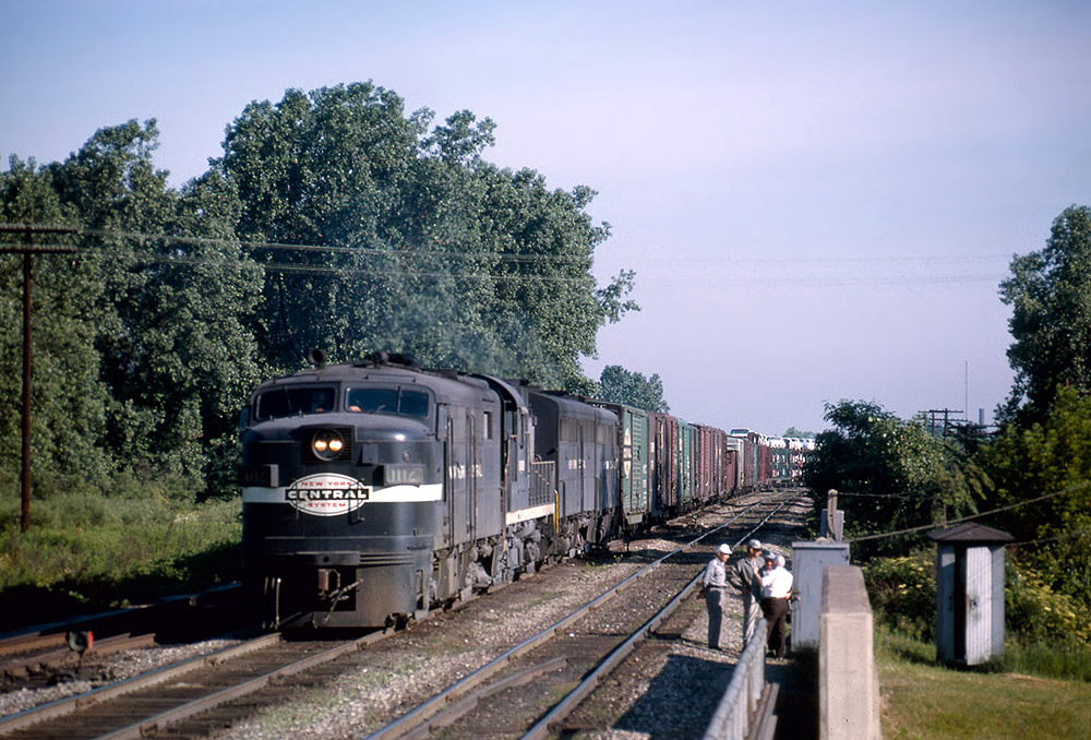Streamlined and road-switcher diesel locomotives with freight train