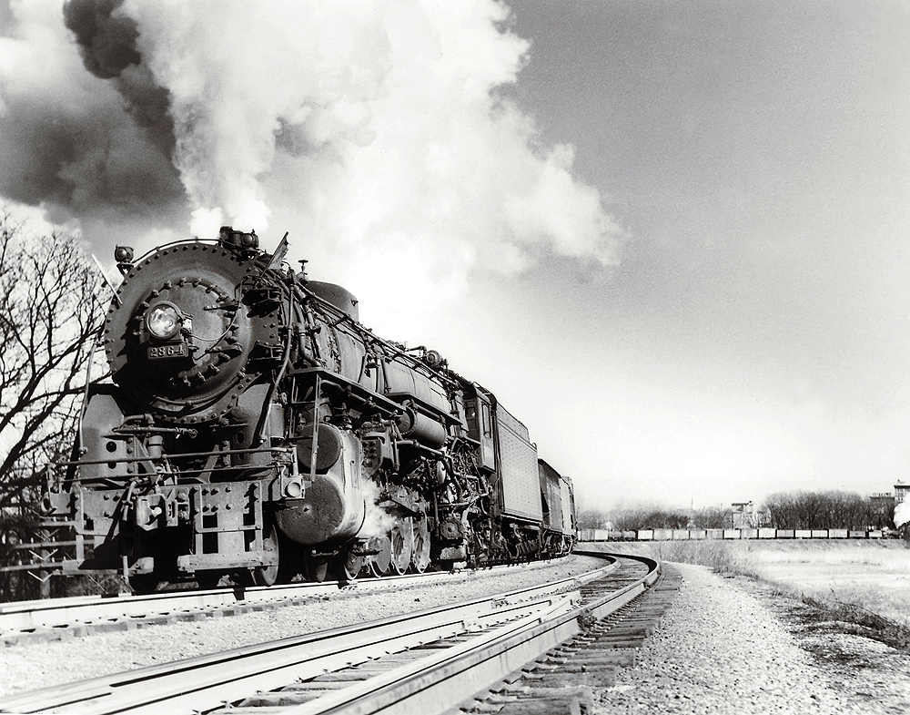 Steam locomotive with freight train