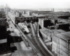 Elevated railroad tracks entering warehouse 