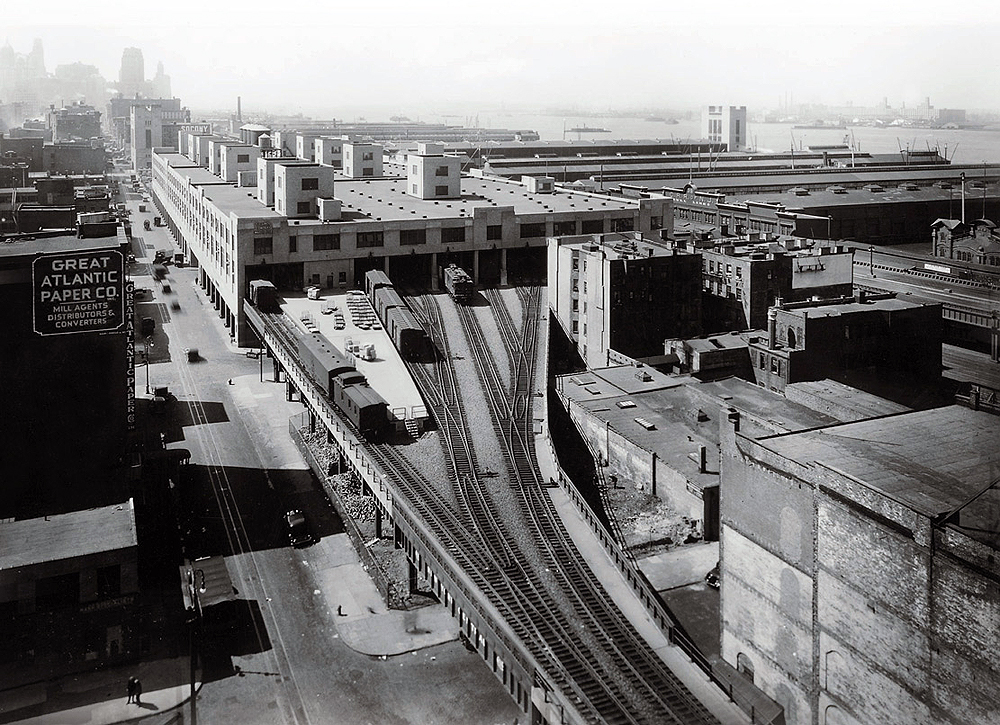 Elevated railroad tracks entering warehouse