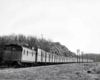 Caboose at end of train of special boxcars 