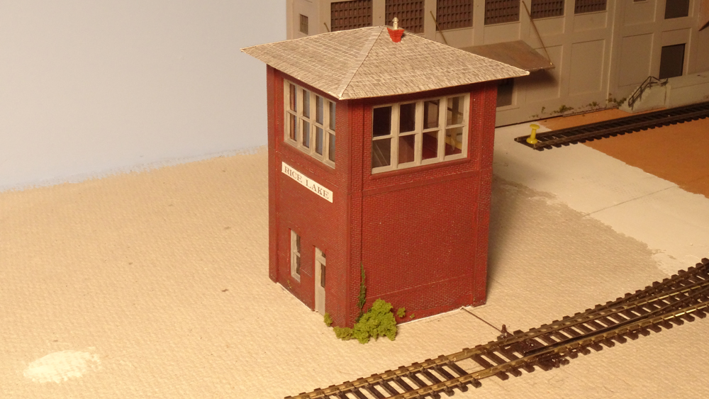 An HO scale model of an interlocking tower conceals the servo seen in the previous photo.