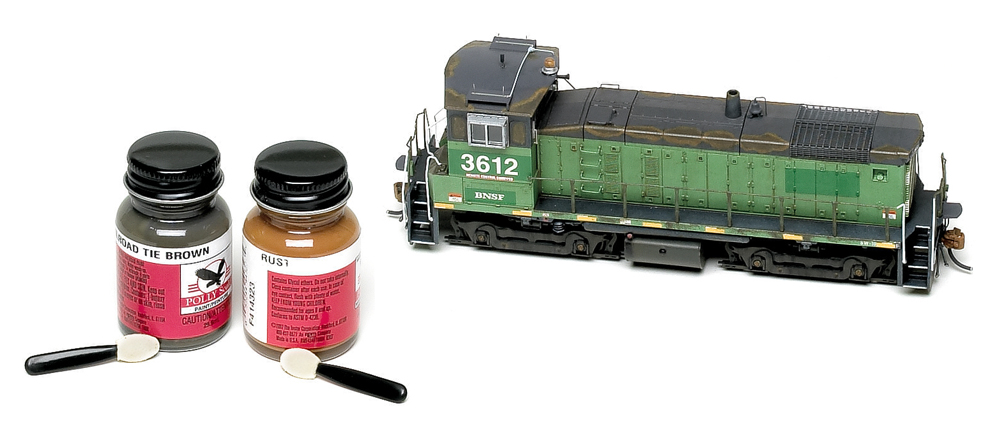 Athearn HO scale SW1000 weathered with acrylic hobby paints and makeup applicators.