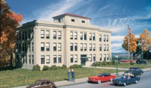 Office building with cars parked out front