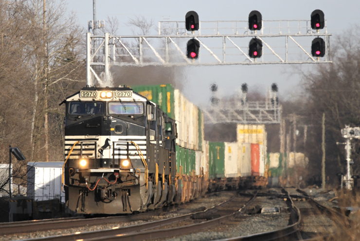 Container train passing overhead signals