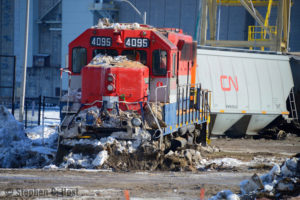 Derailed locomotive and grain hopper