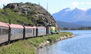 Diesel powered passenger train along water
