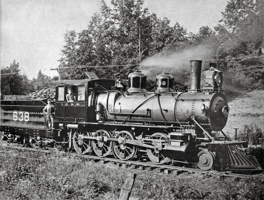 Engineer and fireman on steam locomotive