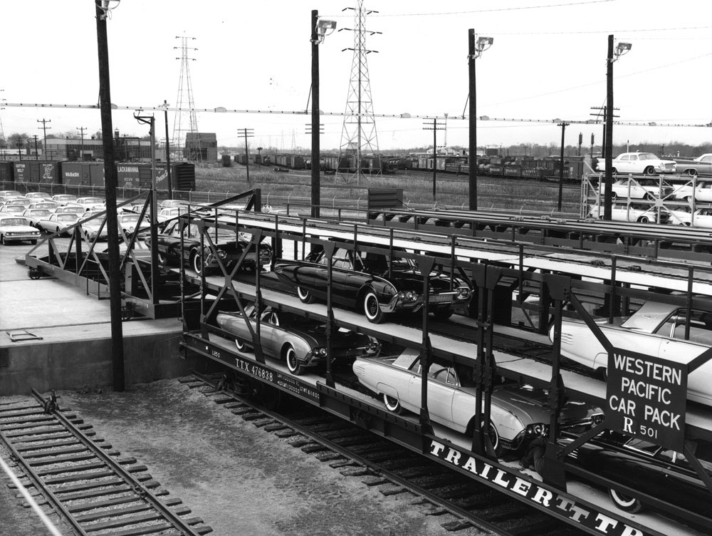 Automobiles being loaded on tri-level freight cars