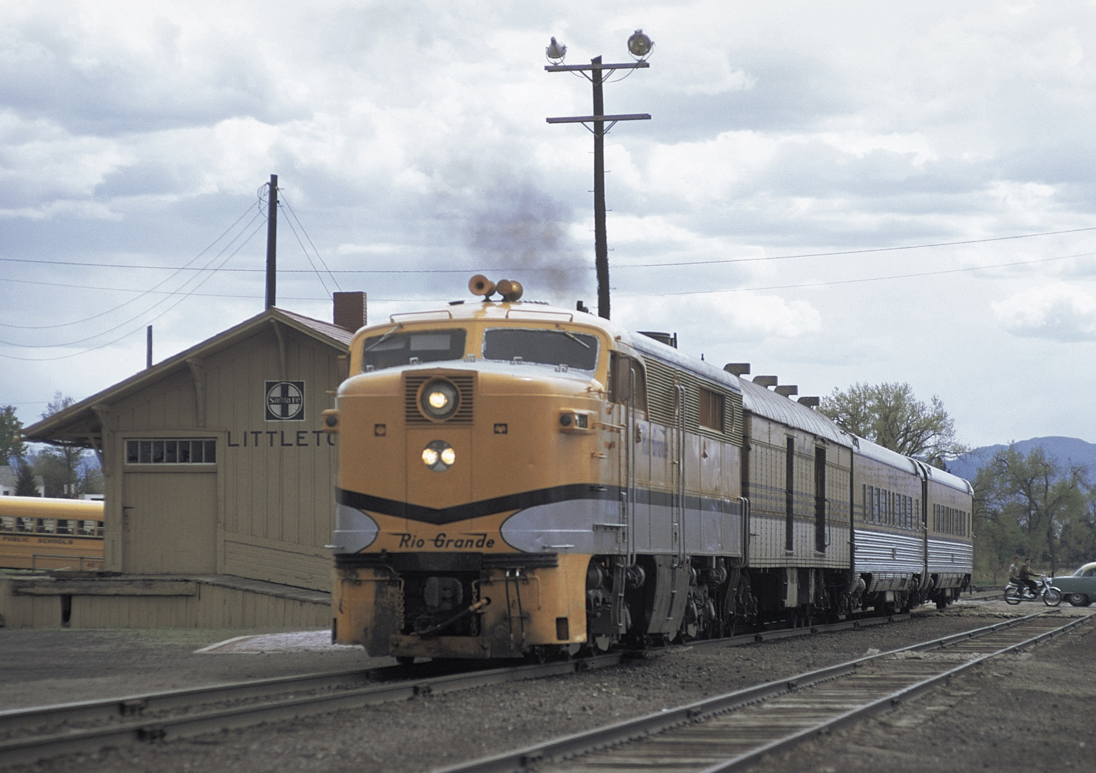 Streamlined diesel locomotive with passenger train