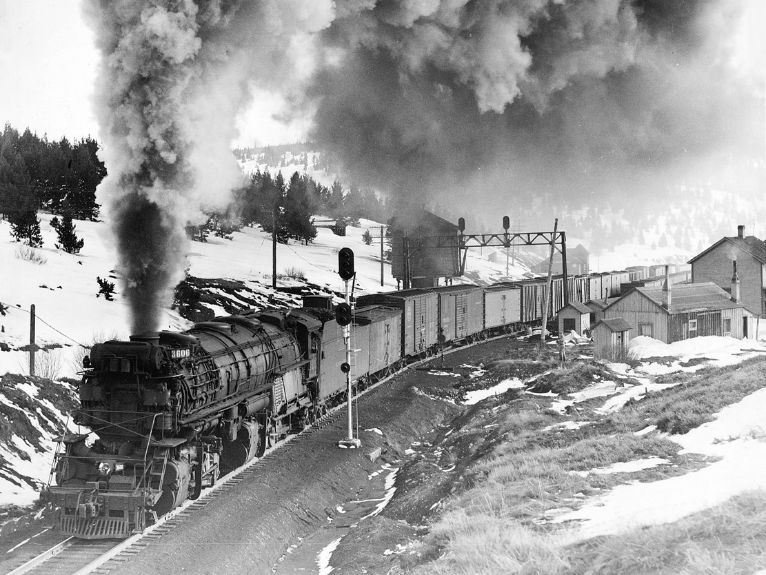 Steam locomotive with freight train