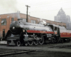 A semi-streamlined locomotive in a rail yard.