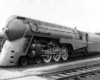 A streamlined steam locomotive at rest.