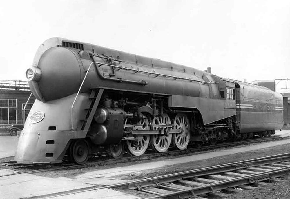 A streamlined steam locomotive at rest.