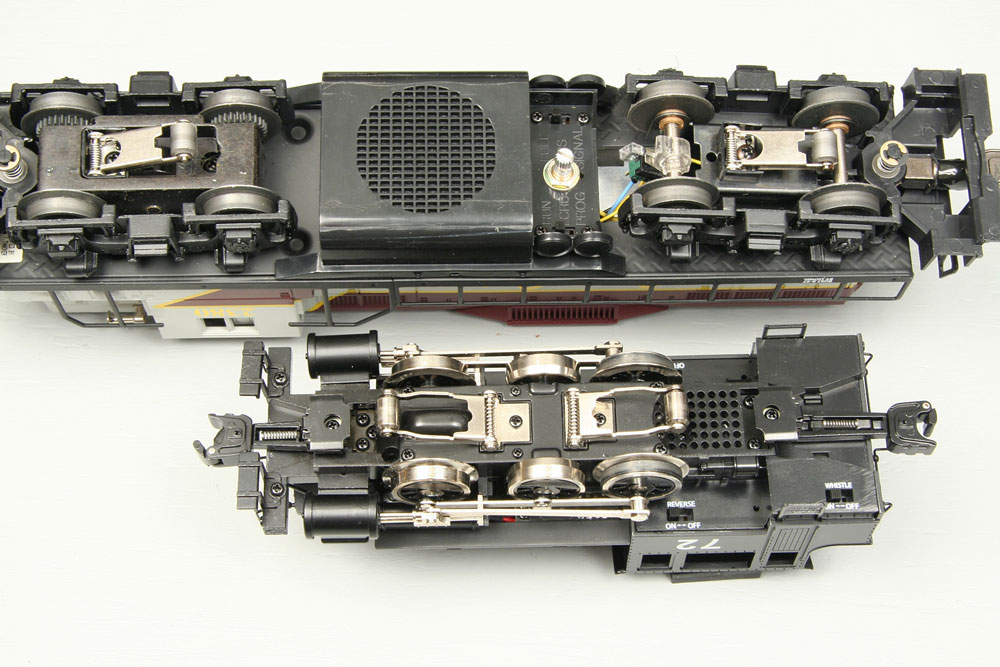 The underside of Lionel 0-6-0t and GP9 locomotives showing the spacing of the pickup rollers.