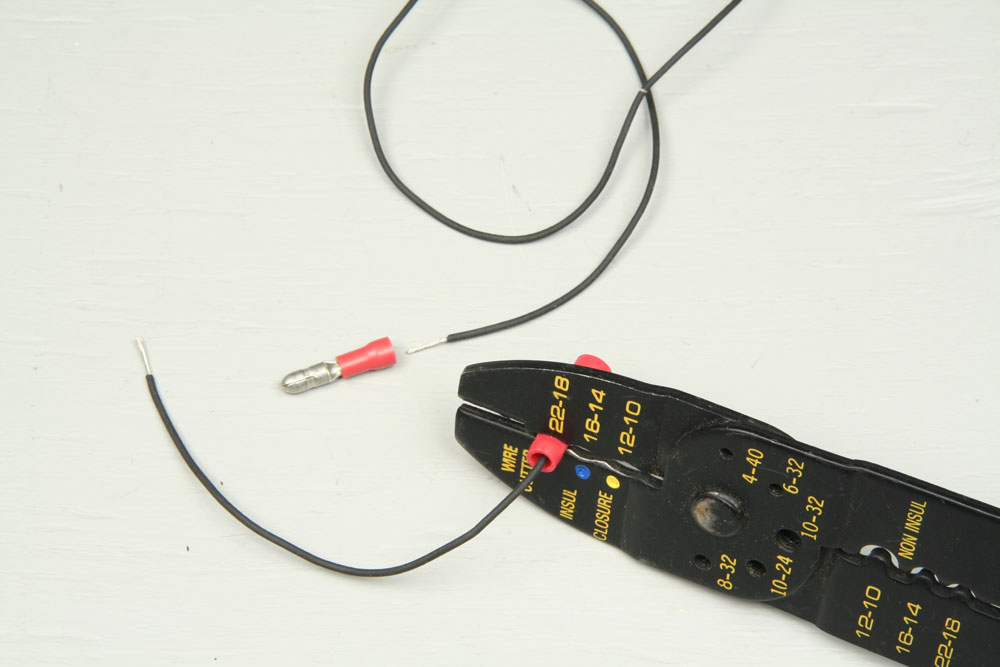 Making a wire harness by crimping male and female solderless connectors each to a length of 24-gauge stranded wire.