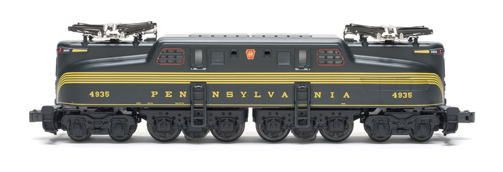 green and gold model electric locomotive