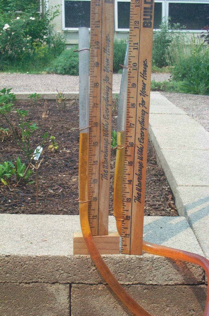 Homemade water level, one side raised one inch to show elevation change.