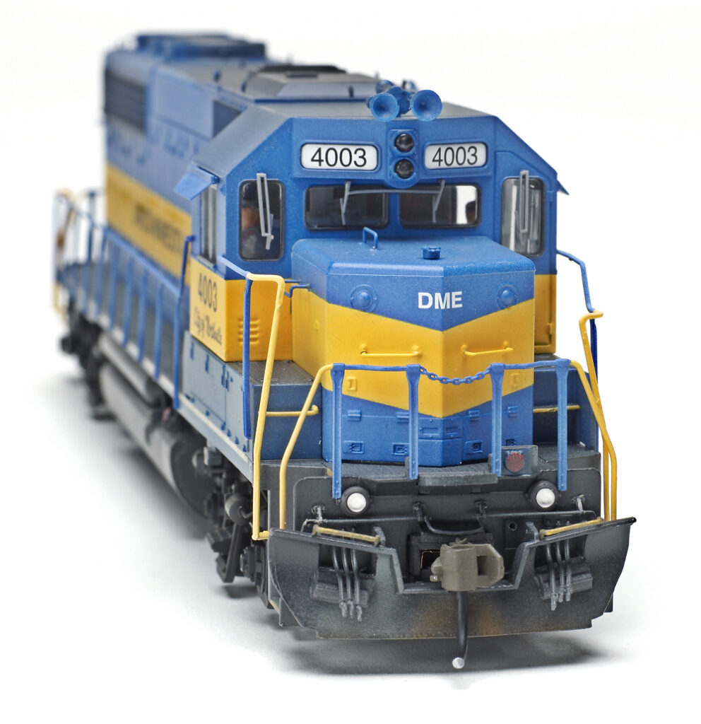 Atlas Model Railroad Co. Electro-Motive Division GP40 diesel locomotive with weathered couplers.