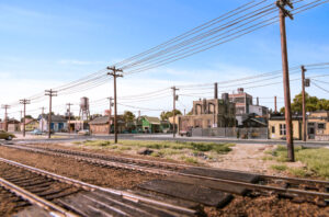 Line of utility poles next to a railroad