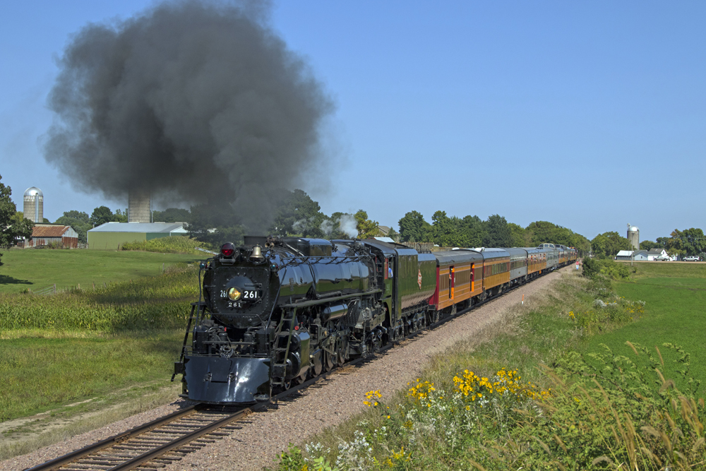 Steam locomotive pulls passenger train