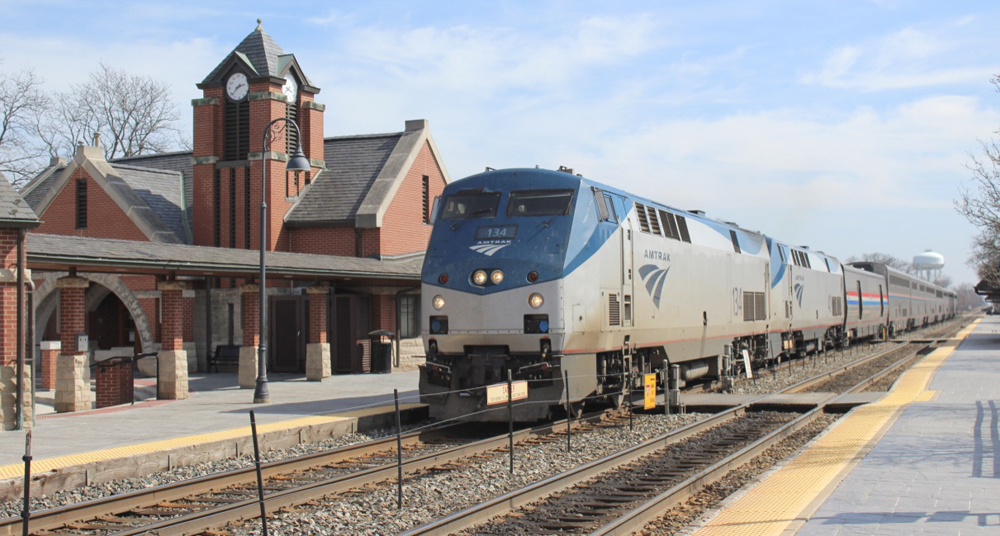 Amtrak train stops at brick station