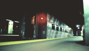 Passenger car in station at night