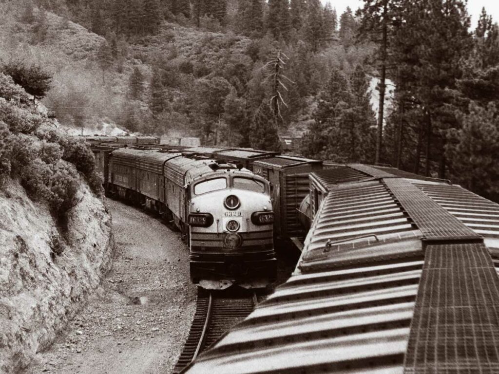 Freight trains pass on mountainside