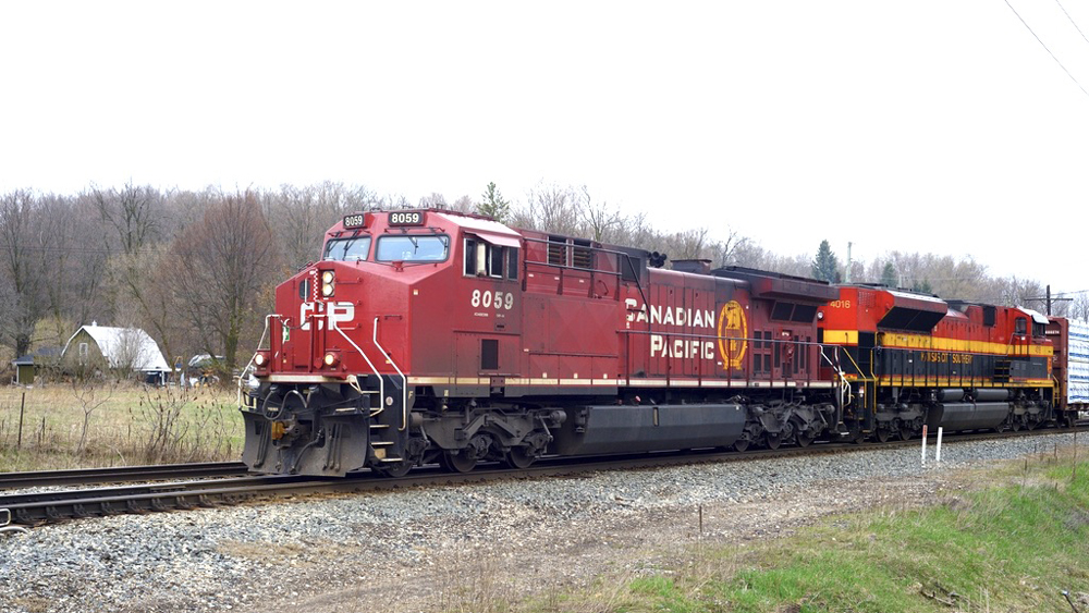 Canadian Pacific and Kansas City Southern engines on freight train