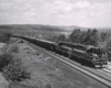 Two road-switcher diesel locomotives with freight train