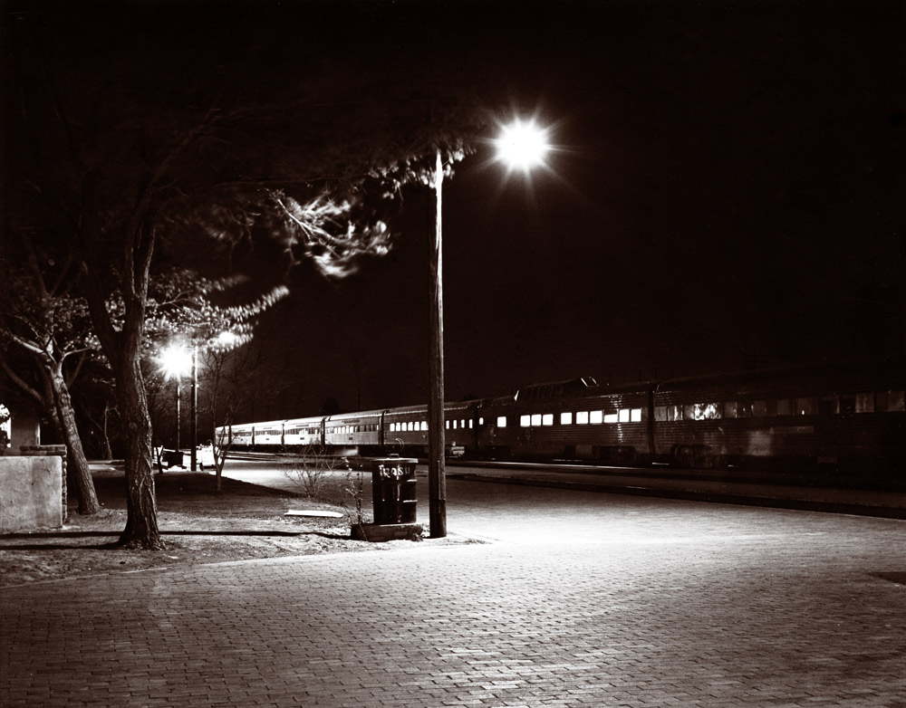 Passenger train at station at night
