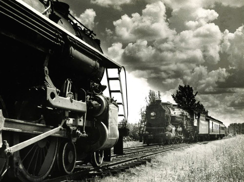 Two steam locomotives "meet" on track.