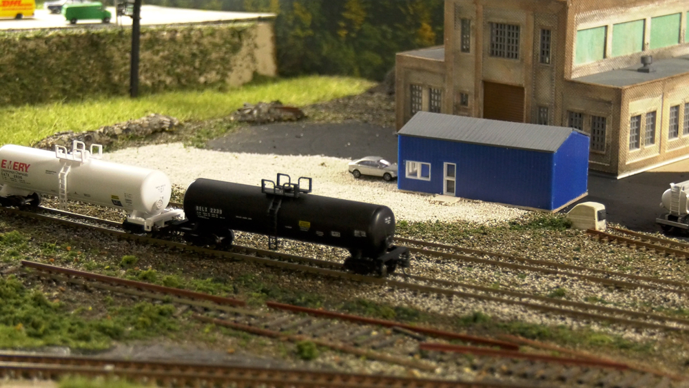Two tanker cars parked on a track