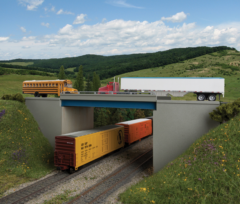 Highway overpass with a train car passing underneath