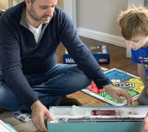 Xavier Turlan unboxing a train with his son Gabriel