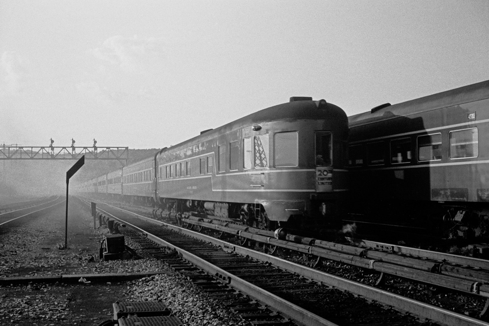 A black-and-white photo of the New York Central passenger train 20th Century Limited receding into the distance