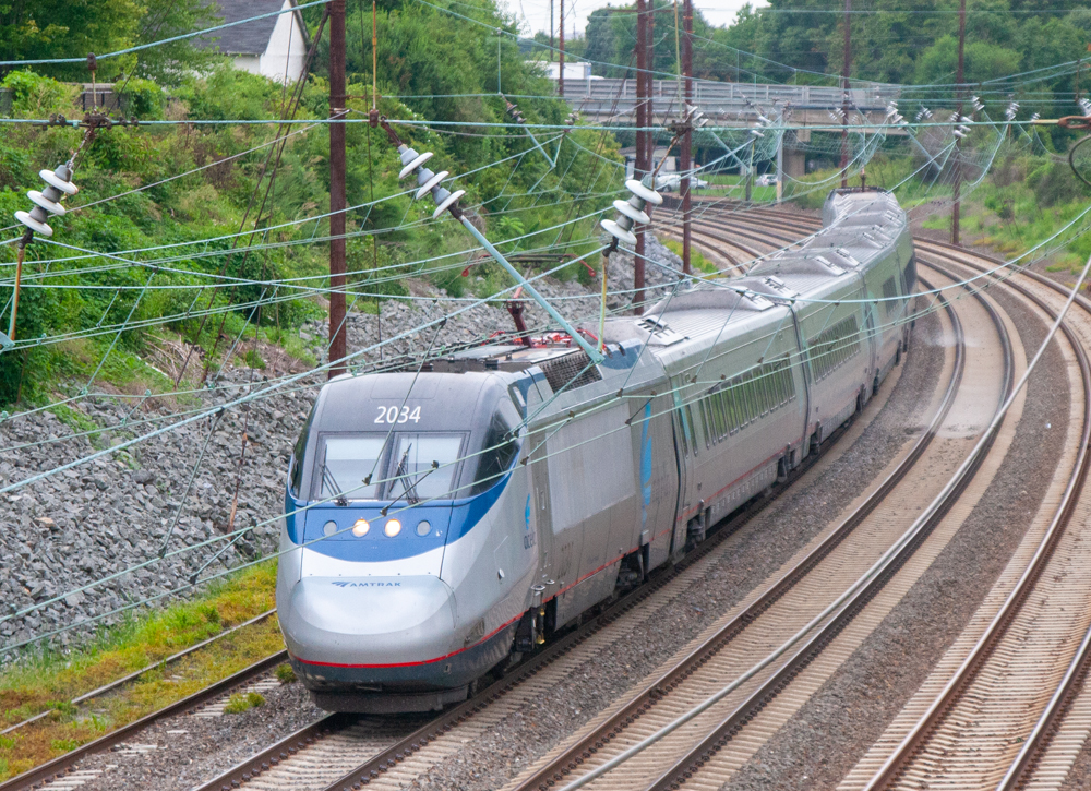 Amtrak Acela train rounds curve.