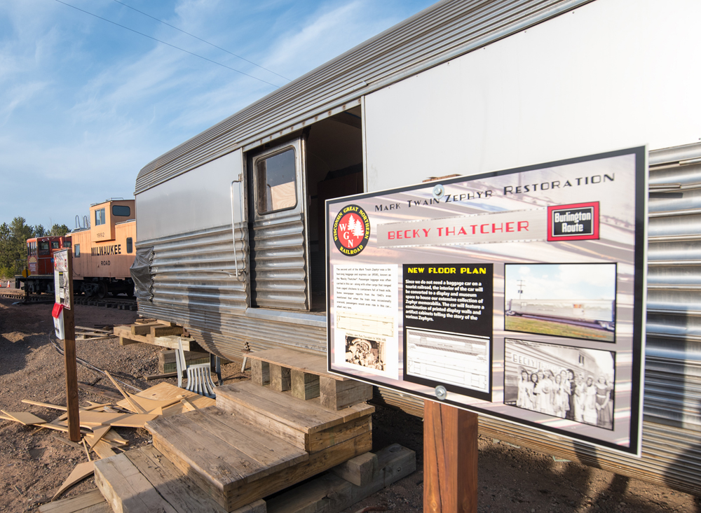 Outside of passenger car with sign describing restoration