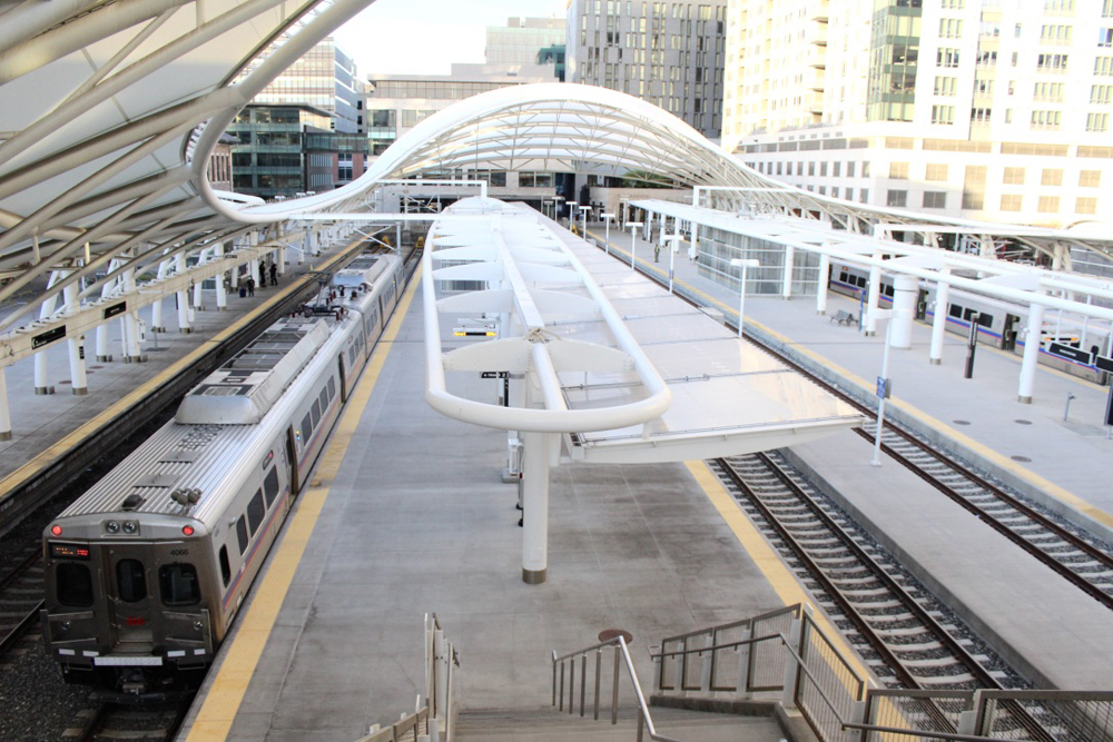 Electrified commuter train at station platform