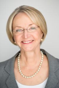 Head shot of woman with short blond hair