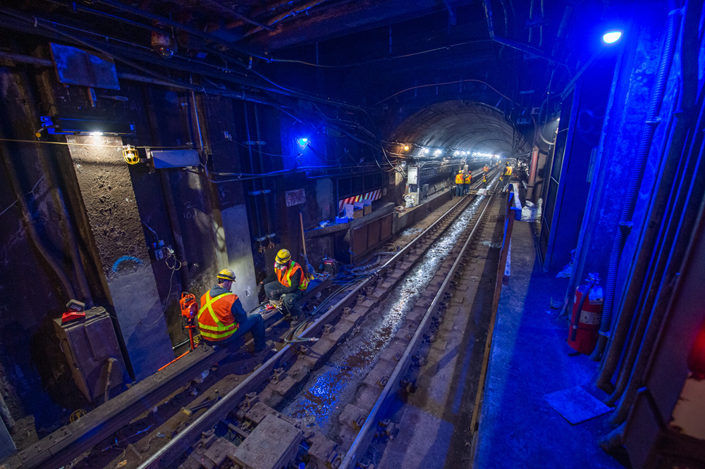 Workers in subway tunnel