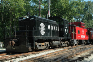 Black switch engine with red caboose